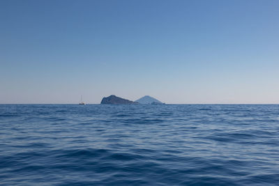 Scenic view of sea against clear sky