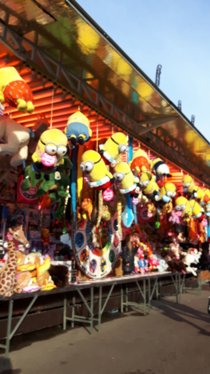 multi colored, architecture, retail, built structure, variation, art and craft, art, decoration, choice, for sale, creativity, railing, low angle view, colorful, store, market stall, large group of objects, market, abundance, incidental people