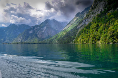 Scenic view of lake and mountains against sky