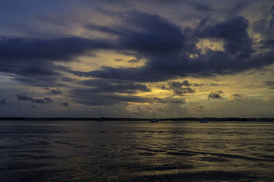 Scenic view of sea against sky at sunset