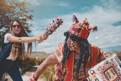 Representation of inca warrior dressed and with battle, prehispanic fighting with a tourist in peru