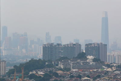 Modern buildings in city against sky