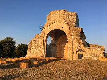 Low angle view of old ruins against clear sky