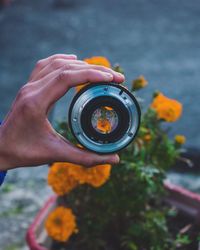 Close-up of hand holding camera