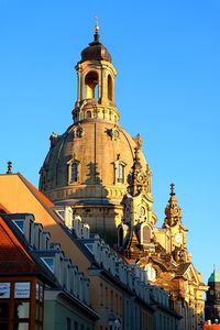 Low angle view of building against blue sky