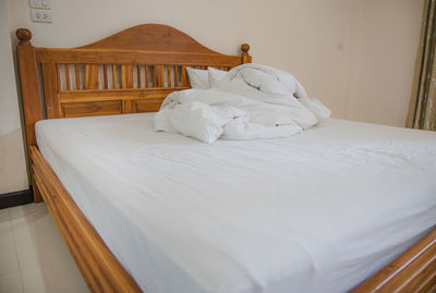 White blanket on bed at home