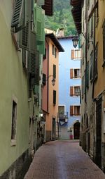 Empty alley amidst buildings in town