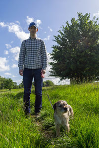 A man walking a border terrier in richmond, uk