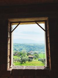 Houses seen through window of building