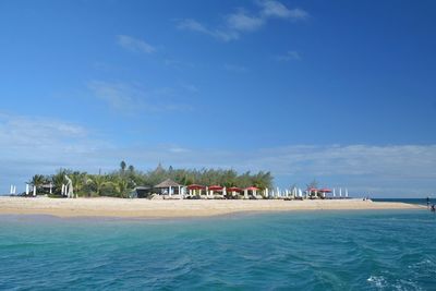 Scenic view of sea against blue sky