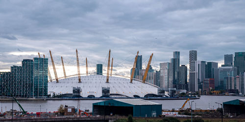 View from the river thames over millennium dome or o2 arena in london.