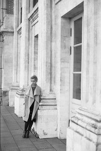 Full length of man walking on staircase in building