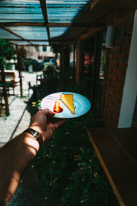 Midsection of person holding ice cream