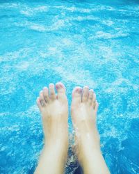 Low section of woman in swimming pool