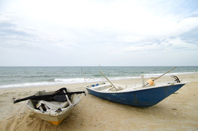 View of boats moored at beach