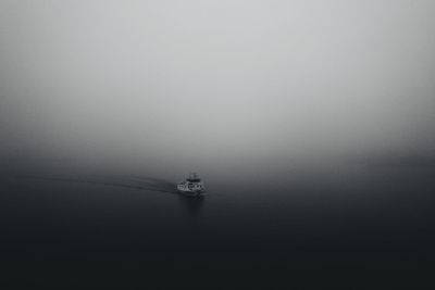 Sailboat sailing on sea against sky