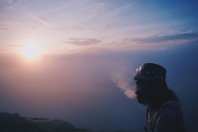 Portrait of man against sky during sunset