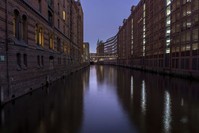 Reflection of illuminated buildings in water