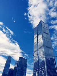 Low angle view of modern buildings against sky