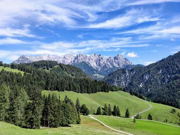 Scenic view of landscape and mountains against sky