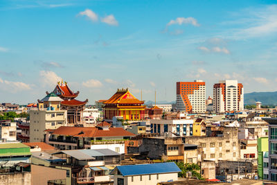 High angle view of buildings in city against sky