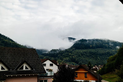 Houses and buildings against sky