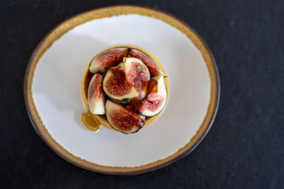 High angle view of fruits in plate on table