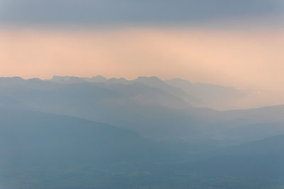 Scenic view of mountains against sky during sunset
