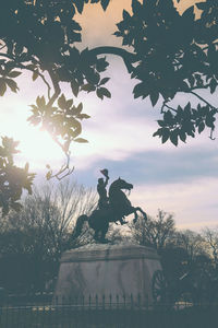 Low angle view of statue against sky during sunset