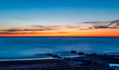 Scenic view of sea at sunset