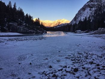 Scenic view of snowcapped mountains against sky during winter