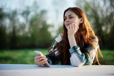 Young woman using mobile phone