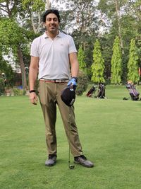 Full length of man standing on golf course