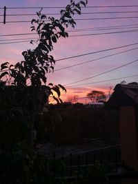 Silhouette of tree against sky at sunset