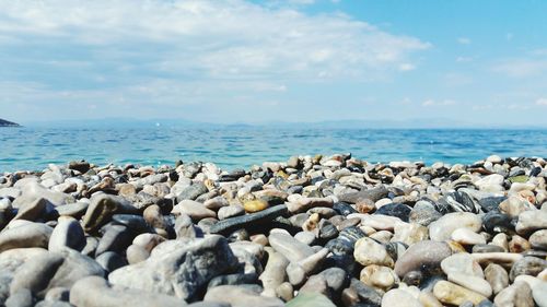 Scenic view of sea against cloudy sky