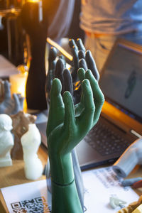 Cropped hand of woman using sound mixer