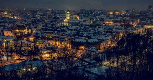 High angle shot of illuminated cityscape against sky at night