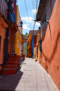 Narrow alley amidst buildings in city