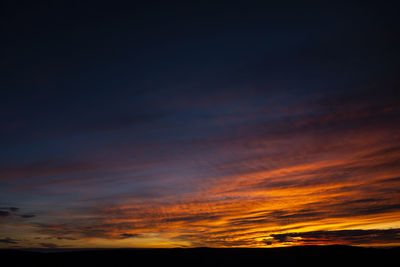 Low angle view of dramatic sky during sunset