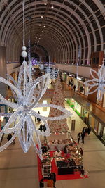Illuminated christmas decoration hanging on ceiling