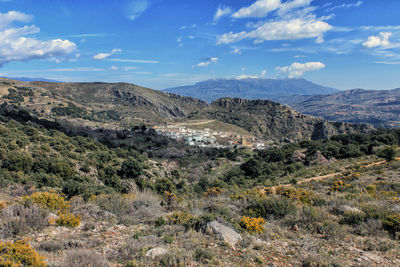Scenic view of landscape of juviles, granada, against sky