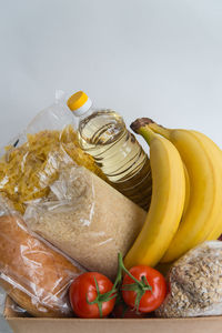 Close-up of fruits on table against white background