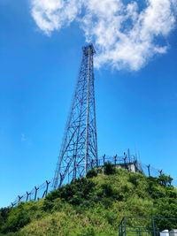 Low angle view of communications tower against sky