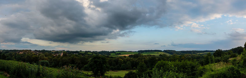 Scenic view of landscape against cloudy sky