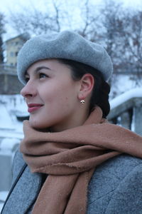 Portrait of beautiful young woman in hat