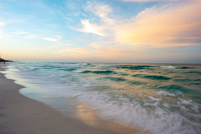 Scenic view of sea against sky during sunset