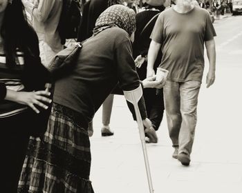 People looking at city street