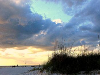 Scenic view of sea against cloudy sky