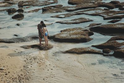 Full length of woman standing on shore