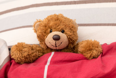 Close-up of stuffed toy on bed